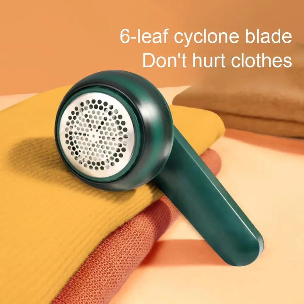 USB rechargeable lint remover with 6-leaf cyclone blade on folded sweaters, fuzz and hair ball trimmer