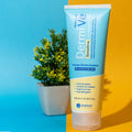 DermiVe Sensitive moisturizer tube for eczema relief and dry skin with potted plant backdrop